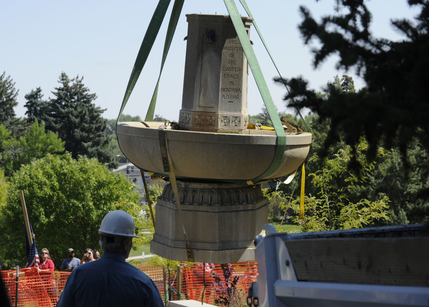 People gather at the controversial Confederate Fountain in Hill Park on Aug. 18, 2017 as city employees, under police guard, remove the fountain.